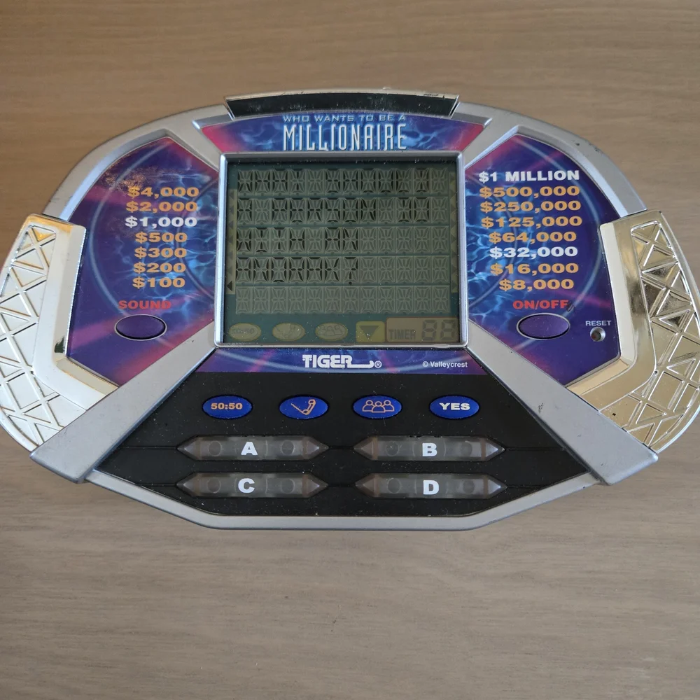 Vtg Who Wants To Be A Millionaire Handheld Electronic LCD Tiger Game Tested Work